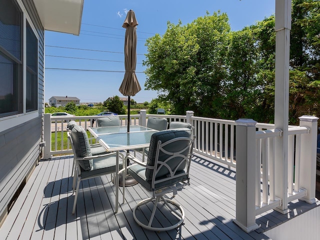 deck with outdoor dining area