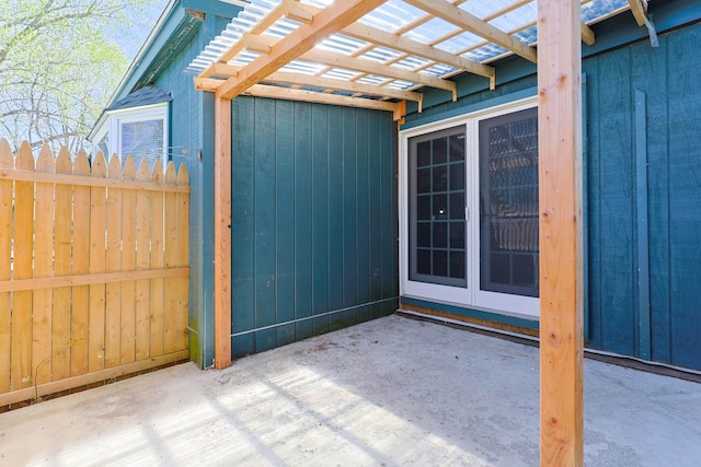 view of patio / terrace featuring fence and a pergola