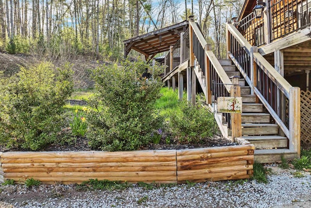 view of yard featuring stairway and a wooden deck