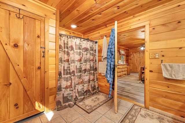 bathroom featuring wooden ceiling, tile patterned flooring, and a shower with shower curtain