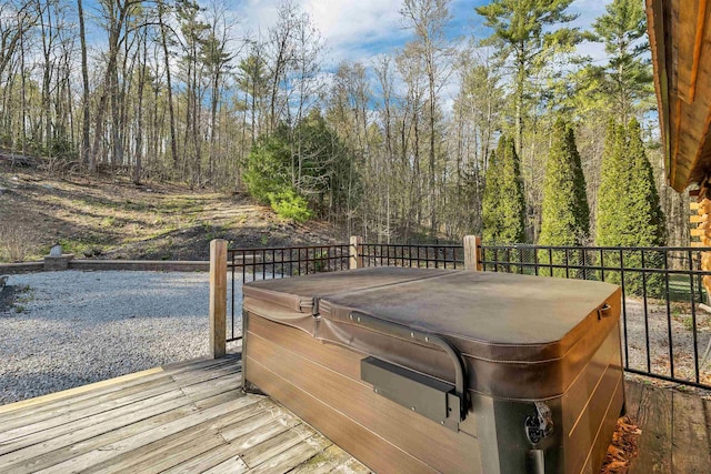 deck with a hot tub and grilling area