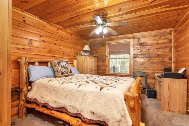 carpeted bedroom with wood walls and wooden ceiling