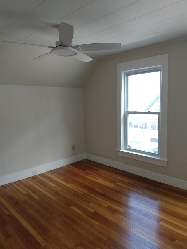 bonus room featuring baseboards, ceiling fan, wood-type flooring, and vaulted ceiling