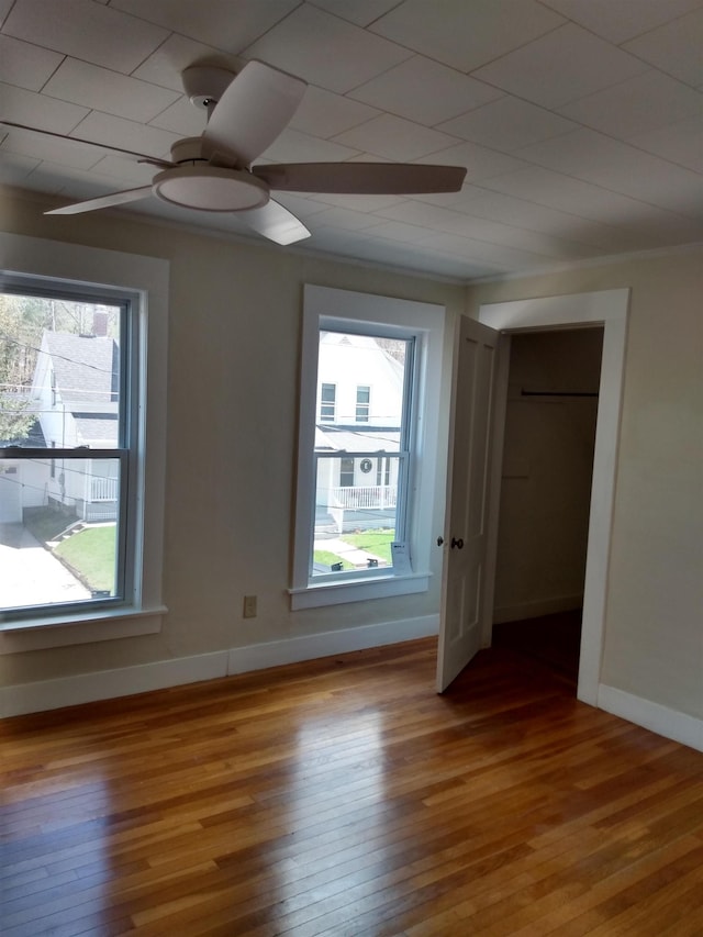empty room featuring hardwood / wood-style floors and a wealth of natural light