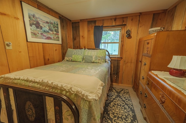 bedroom featuring wood walls