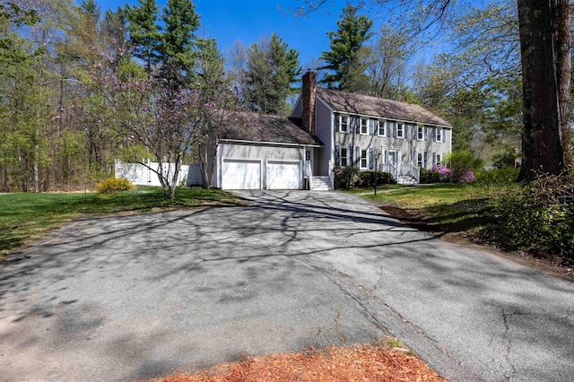 exterior space featuring aphalt driveway