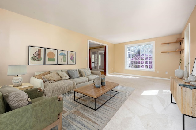 living room with carpet floors and baseboards