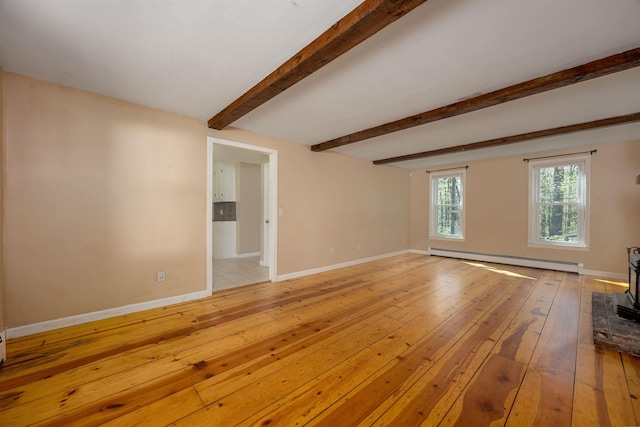unfurnished living room featuring a wood stove, beam ceiling, baseboards, a baseboard heating unit, and light wood-style floors