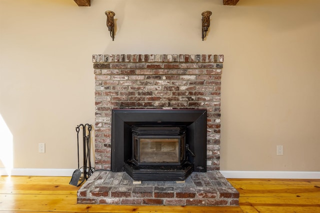 room details with baseboards and wood finished floors