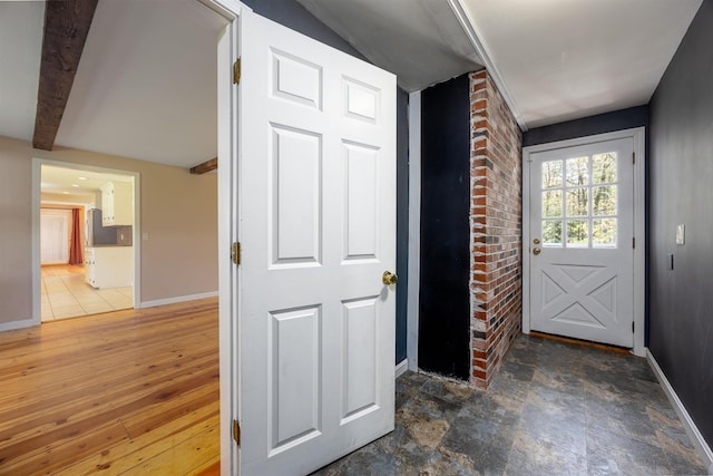 interior space featuring baseboards