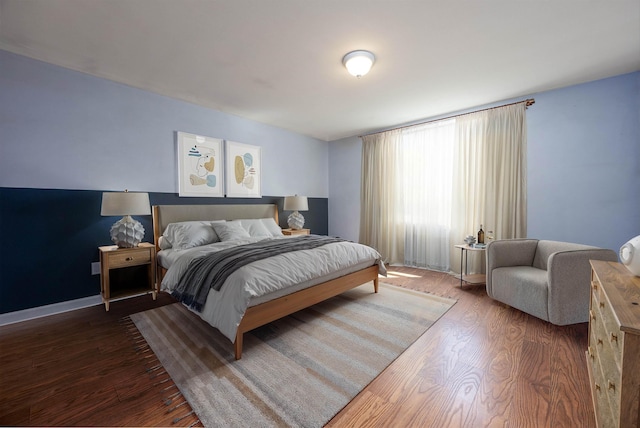 bedroom featuring dark wood-style flooring