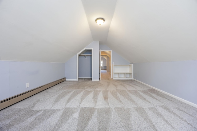 additional living space with baseboards, carpet, lofted ceiling, and baseboard heating