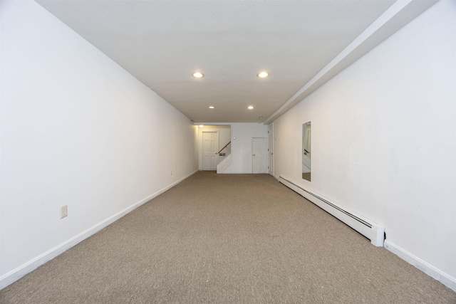 spare room featuring recessed lighting, baseboards, stairs, and a baseboard heating unit