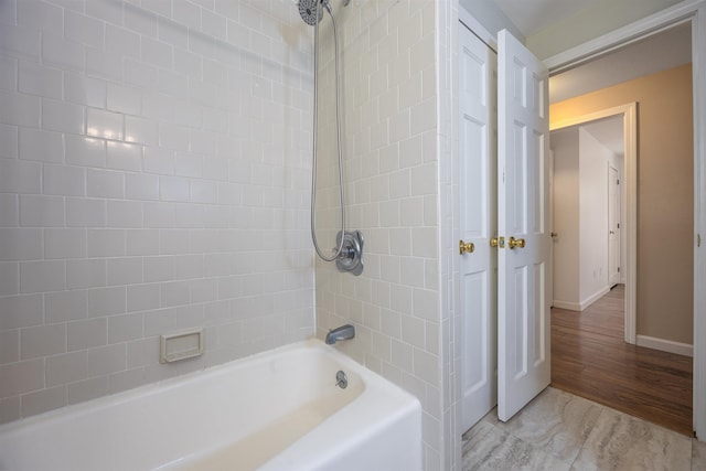 full bathroom with baseboards and shower / washtub combination