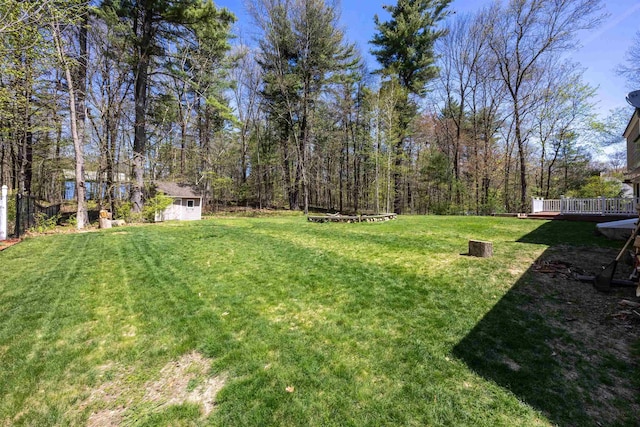 view of yard featuring a wooden deck
