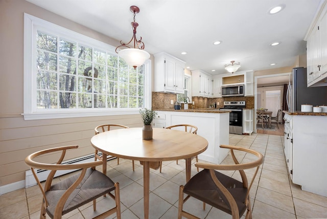 dining space with recessed lighting and light tile patterned floors