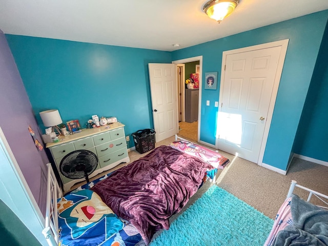 bedroom with carpet flooring and baseboards