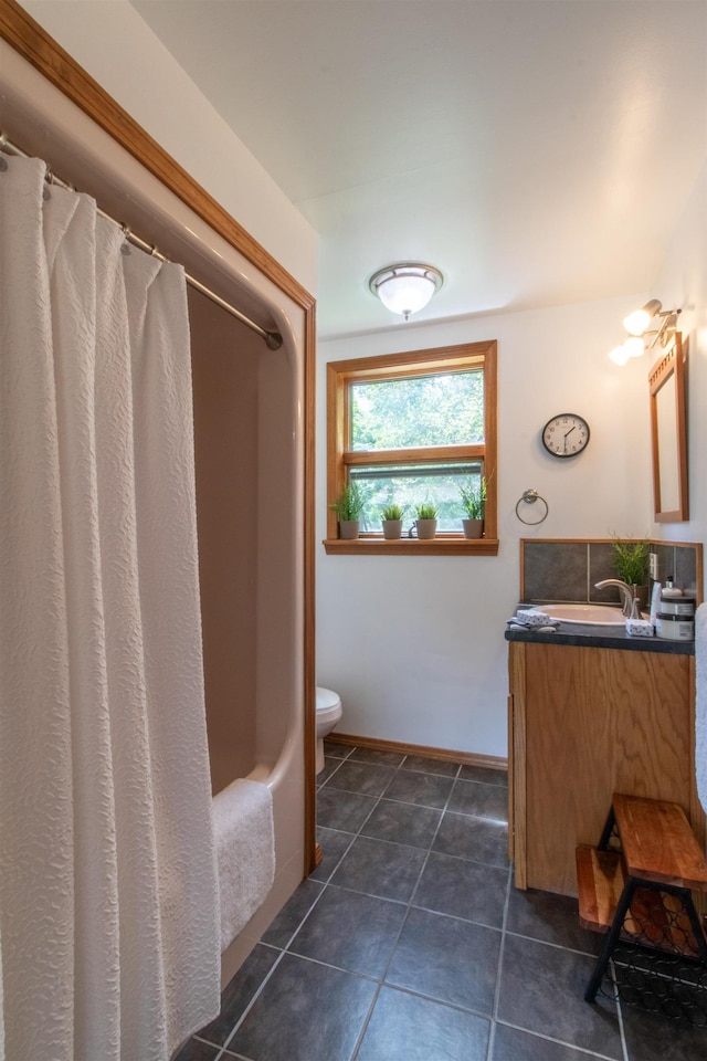 full bath featuring vanity, tile patterned flooring, shower / bath combination with curtain, toilet, and baseboards