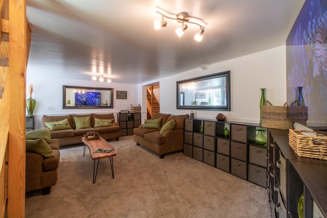 carpeted living area with stairway