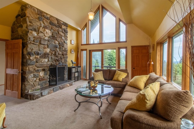 living room featuring high vaulted ceiling, carpet flooring, and a stone fireplace