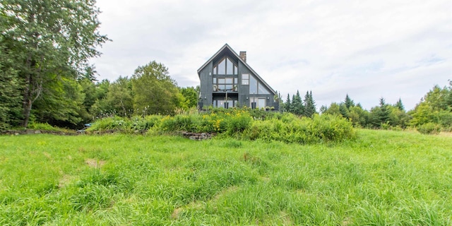 back of property featuring a chimney