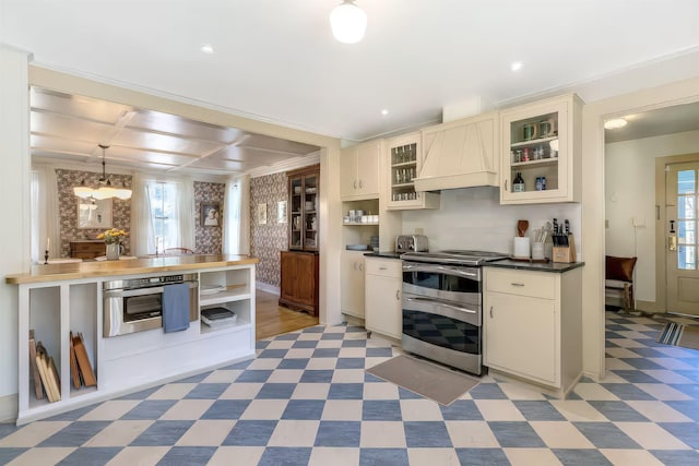 kitchen featuring stainless steel appliances, custom exhaust hood, a healthy amount of sunlight, and light floors