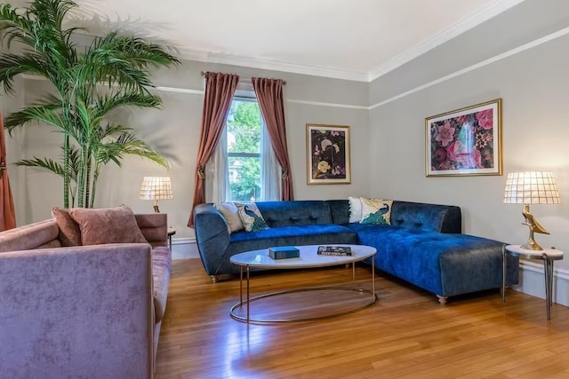 living room with ornamental molding and wood finished floors
