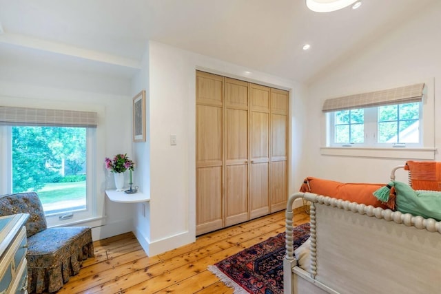 bedroom featuring vaulted ceiling, baseboards, a closet, light wood finished floors, and recessed lighting