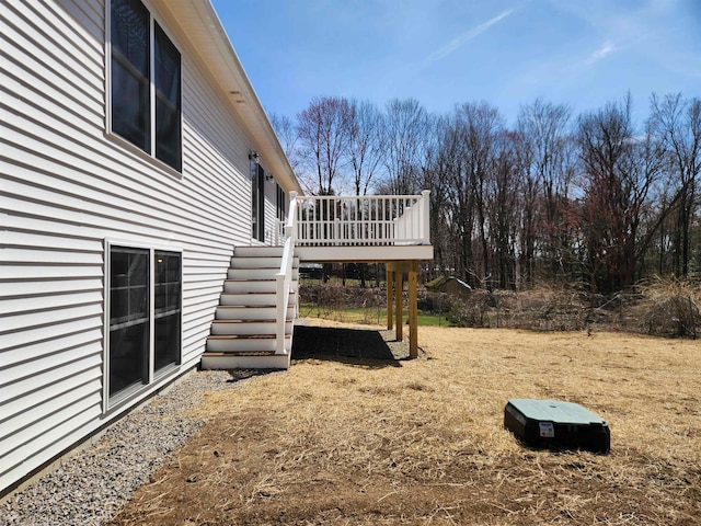 view of yard featuring stairs and a deck