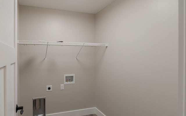 clothes washing area with baseboards, hookup for an electric dryer, laundry area, and hookup for a washing machine