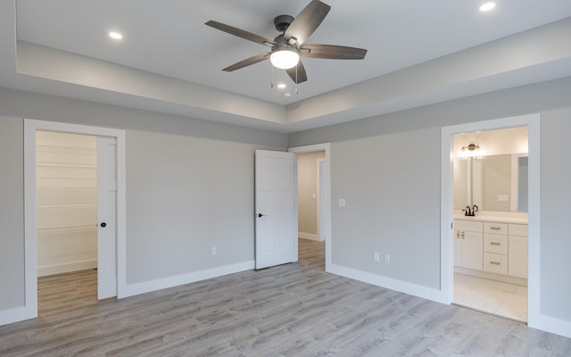 unfurnished bedroom featuring recessed lighting, baseboards, and light wood-style floors