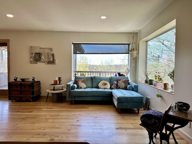 living area featuring recessed lighting and light wood-style floors