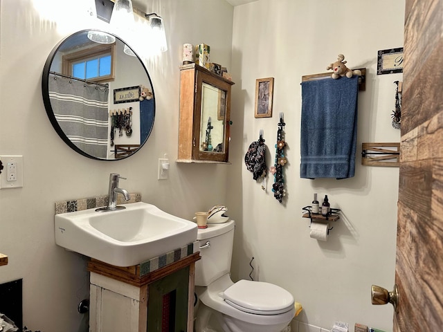 full bathroom with vanity and toilet