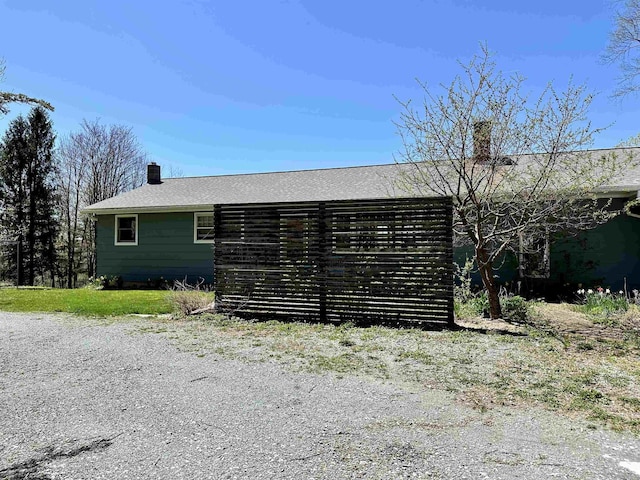 view of home's exterior featuring a chimney