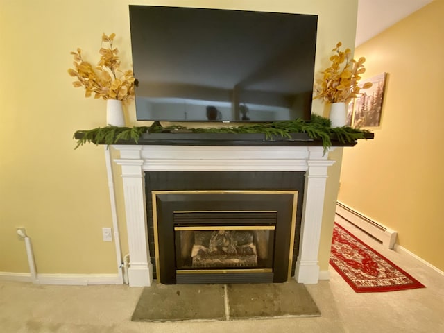 details with baseboards, carpet, a glass covered fireplace, and baseboard heating