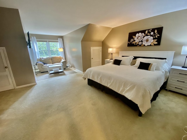 bedroom featuring baseboards and light carpet