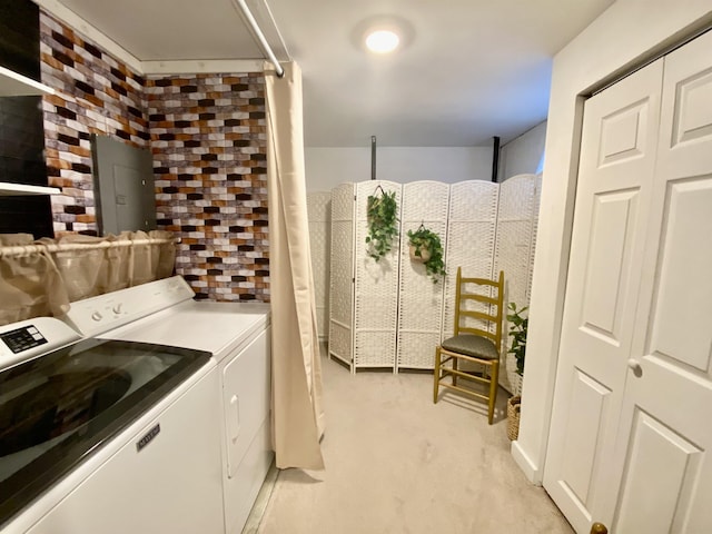 laundry room with laundry area, washer and clothes dryer, and light carpet