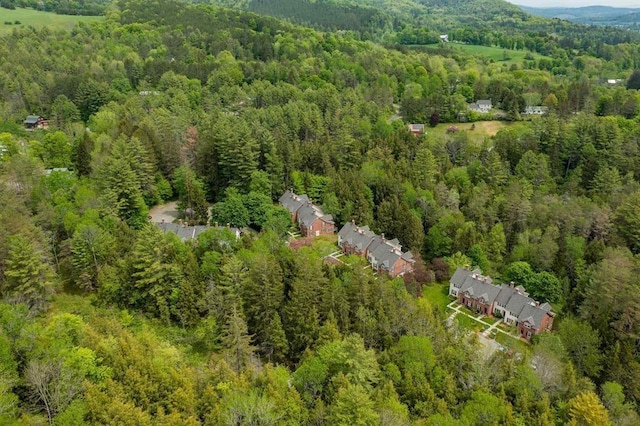birds eye view of property with a forest view