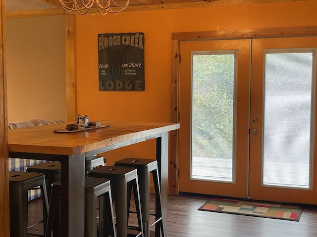 dining area featuring french doors and wood finished floors