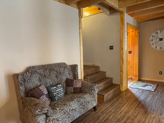 interior space with stairway, arched walkways, and wood finished floors