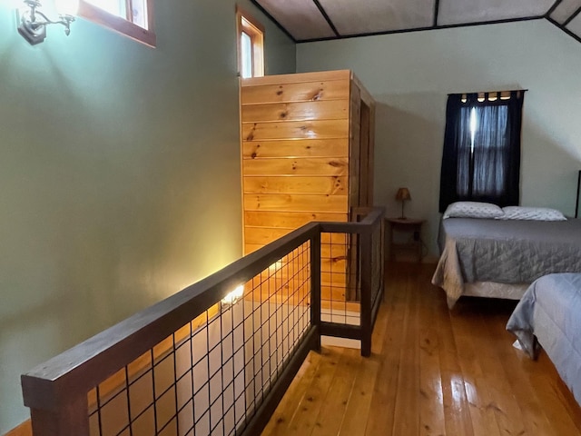 bedroom with hardwood / wood-style floors
