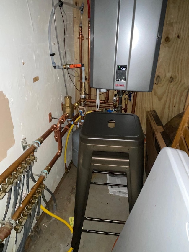 utility room featuring tankless water heater