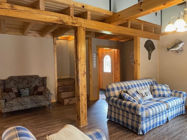 living room with beamed ceiling and wood finished floors