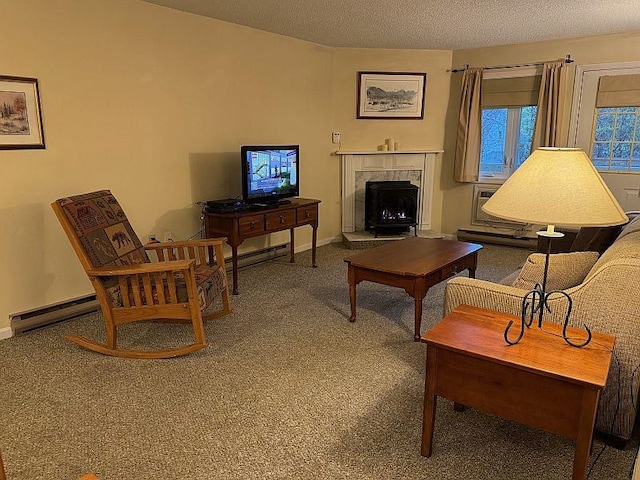 living area featuring carpet floors, baseboards, a baseboard heating unit, and a premium fireplace