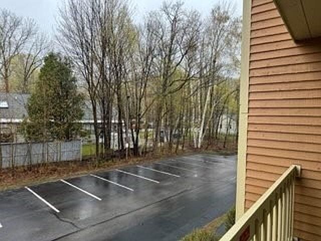 uncovered parking lot with fence