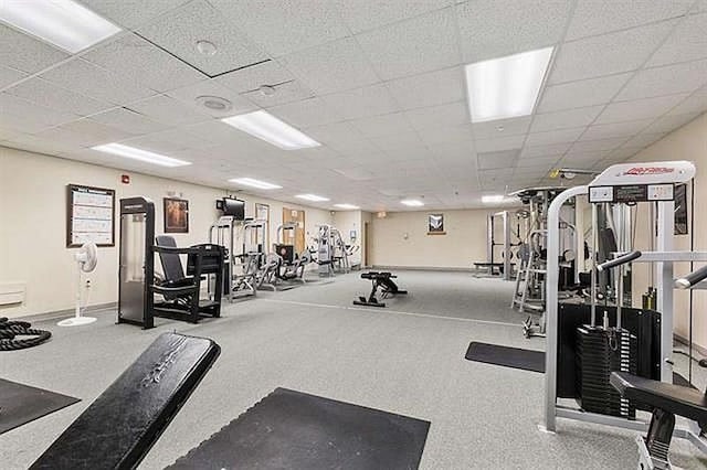 workout area featuring a paneled ceiling