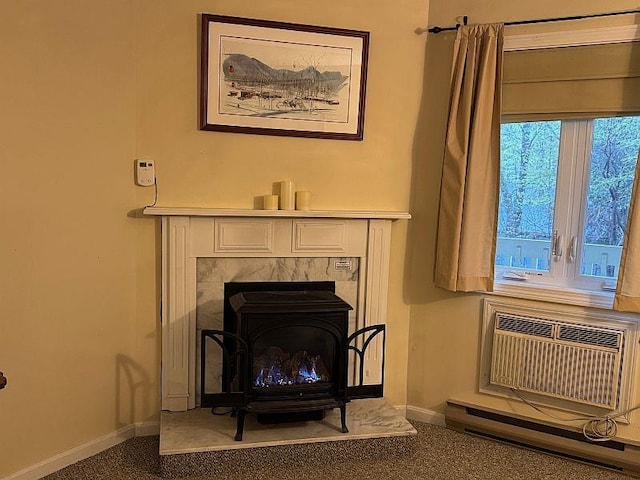 room details featuring baseboards, a wood stove, carpet floors, and an AC wall unit