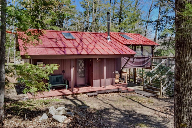 146 Dundee Rd, Bartlett, NH 03845 - exterior space featuring a wooden deck, metal roof, stairway, and a standing seam roof