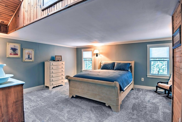 carpeted bedroom featuring baseboards and ornamental molding
