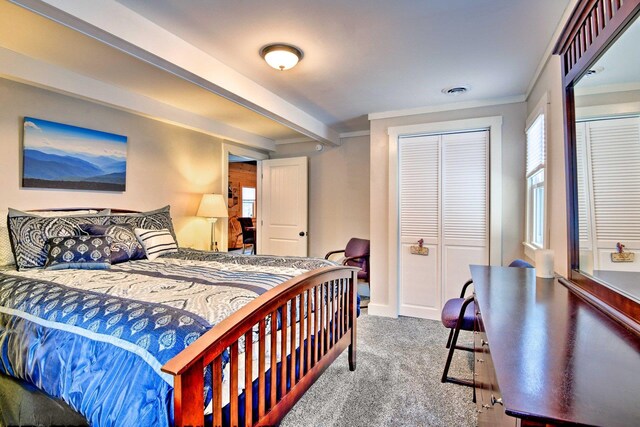bedroom featuring carpet floors, baseboards, crown molding, and beam ceiling